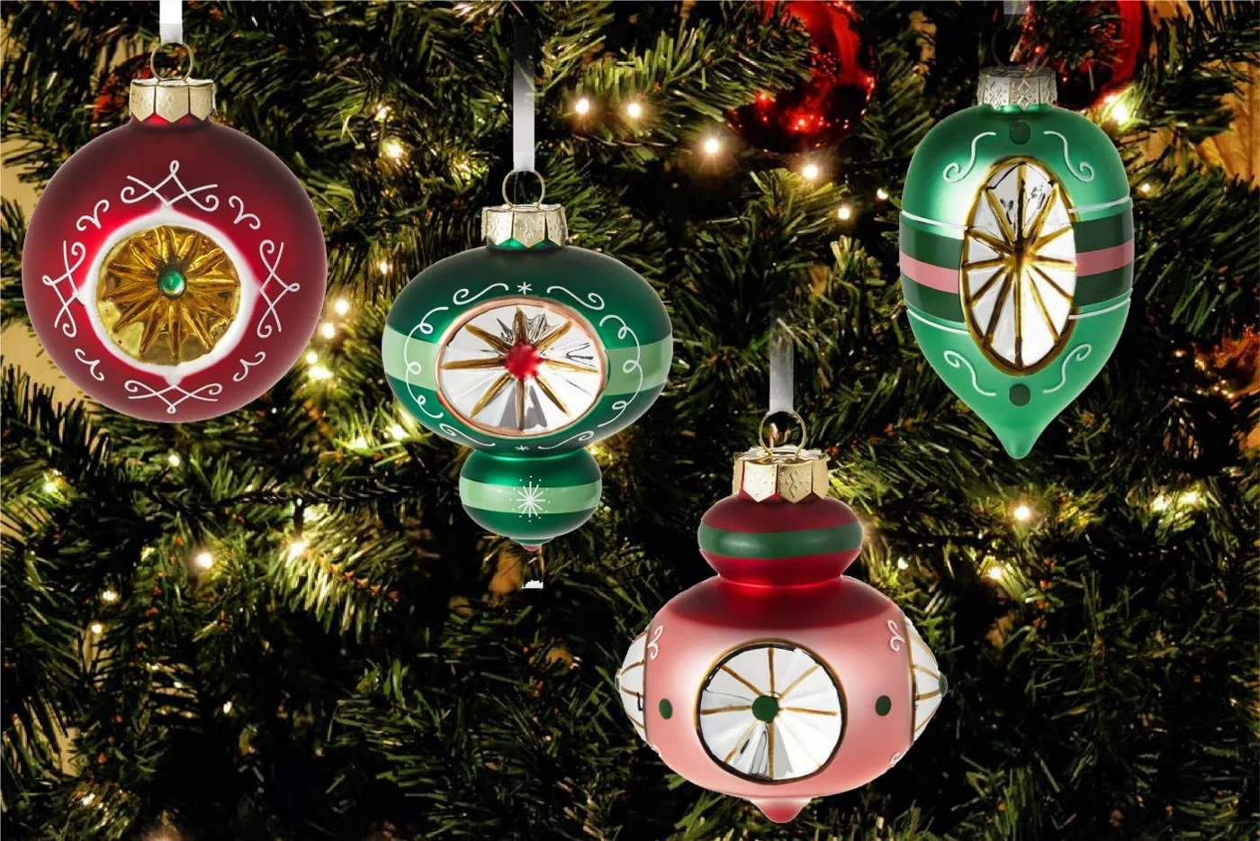 Decorative glass Christmas ornaments with clock and ribbon motifs hanging on a Christmas tree