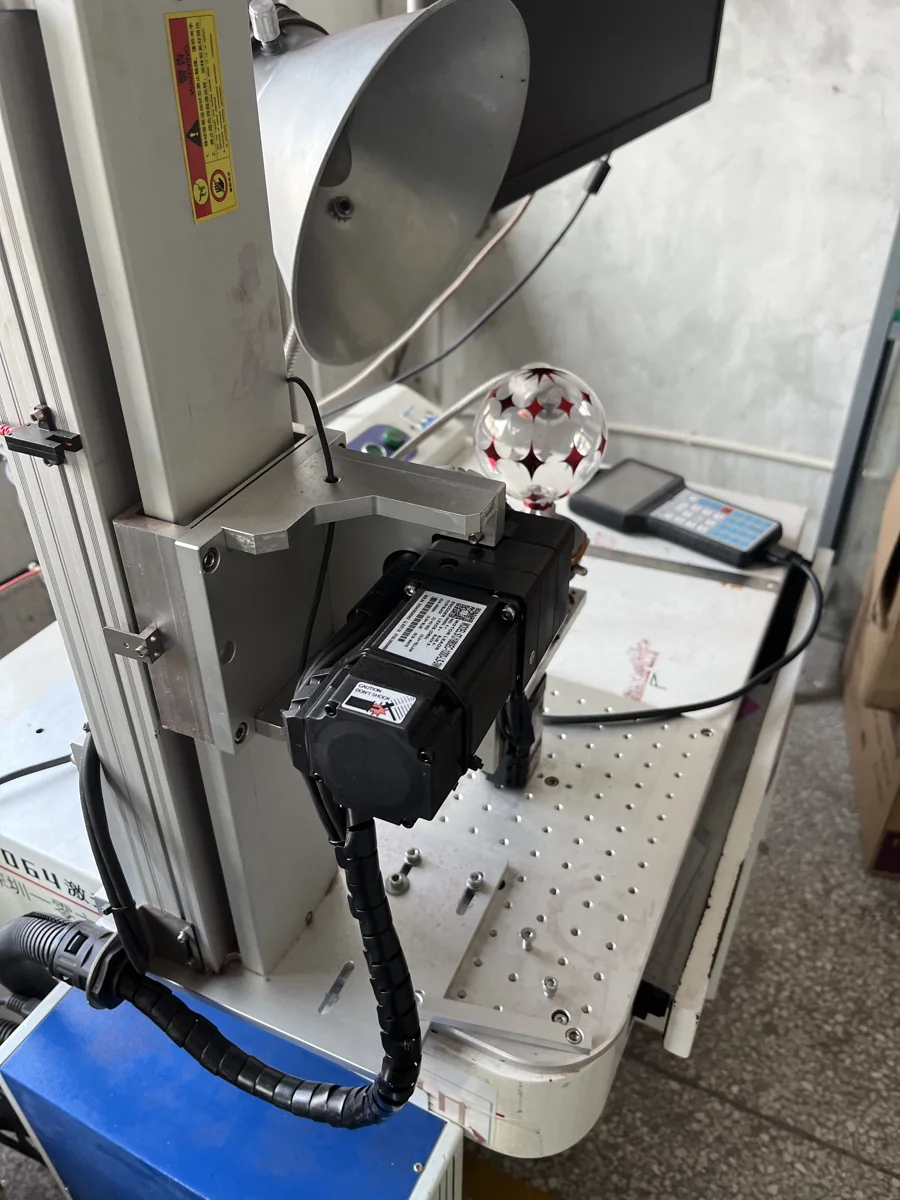 Laser engraving equipment working on a decorated glass ball