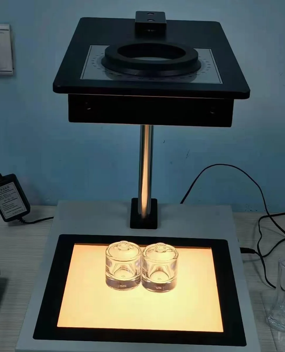 Glass items positioned at a stress testing station