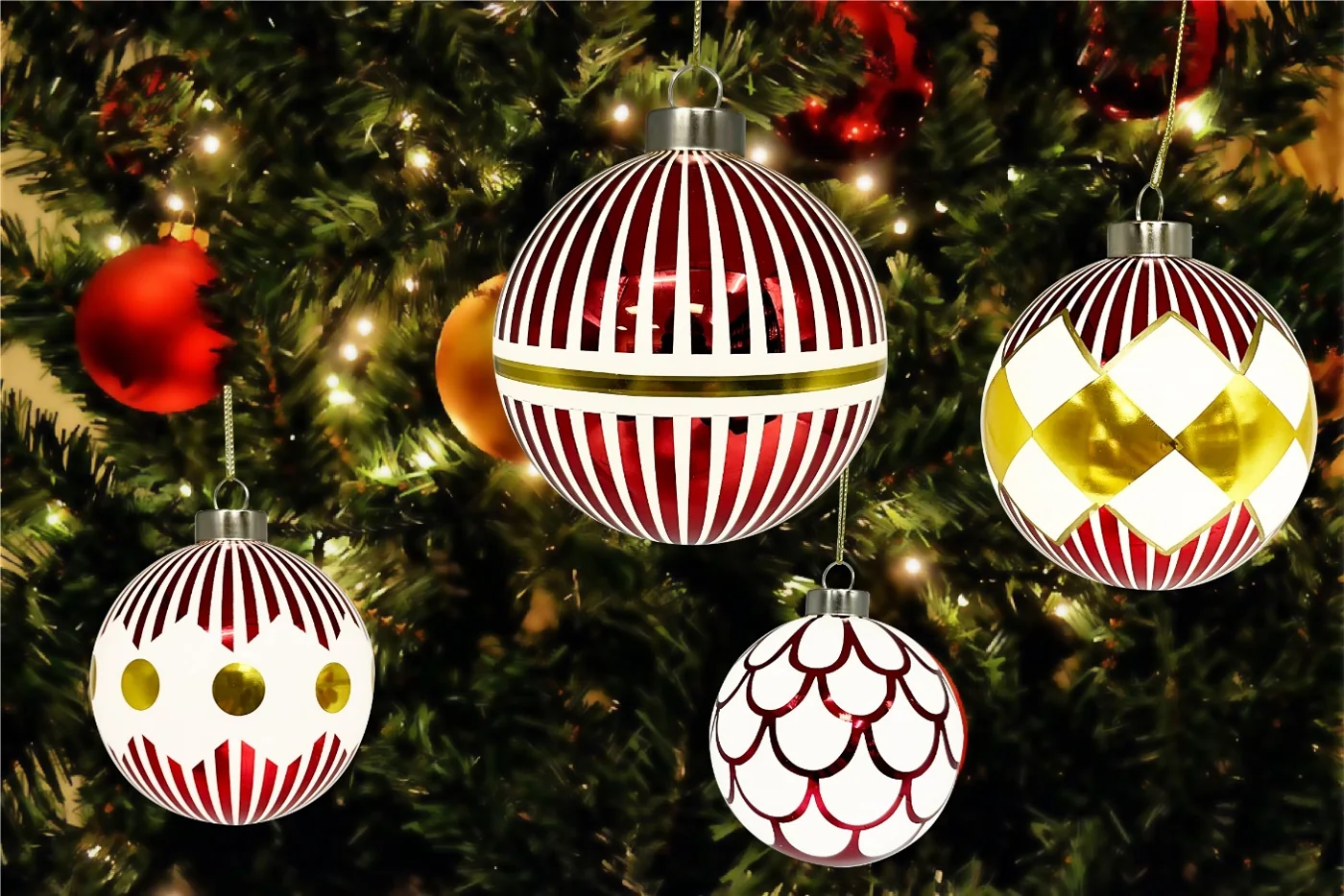Red, white and gold printed shatterproof Christmas balls hanging on a Christmas tree